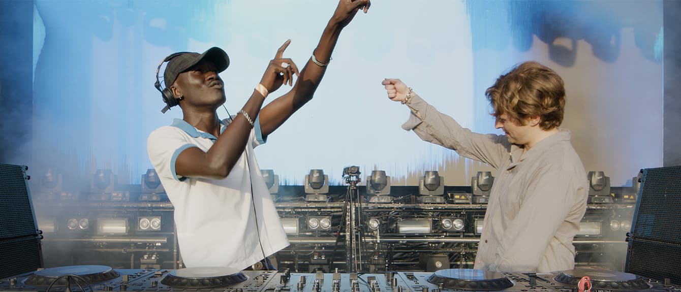 Bedroom music producer setup with vibrant lighting